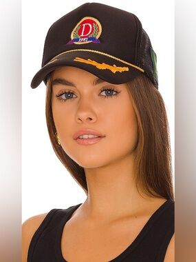 Danzy trucker hat featuring a crest with the letter "D" and the year 1981